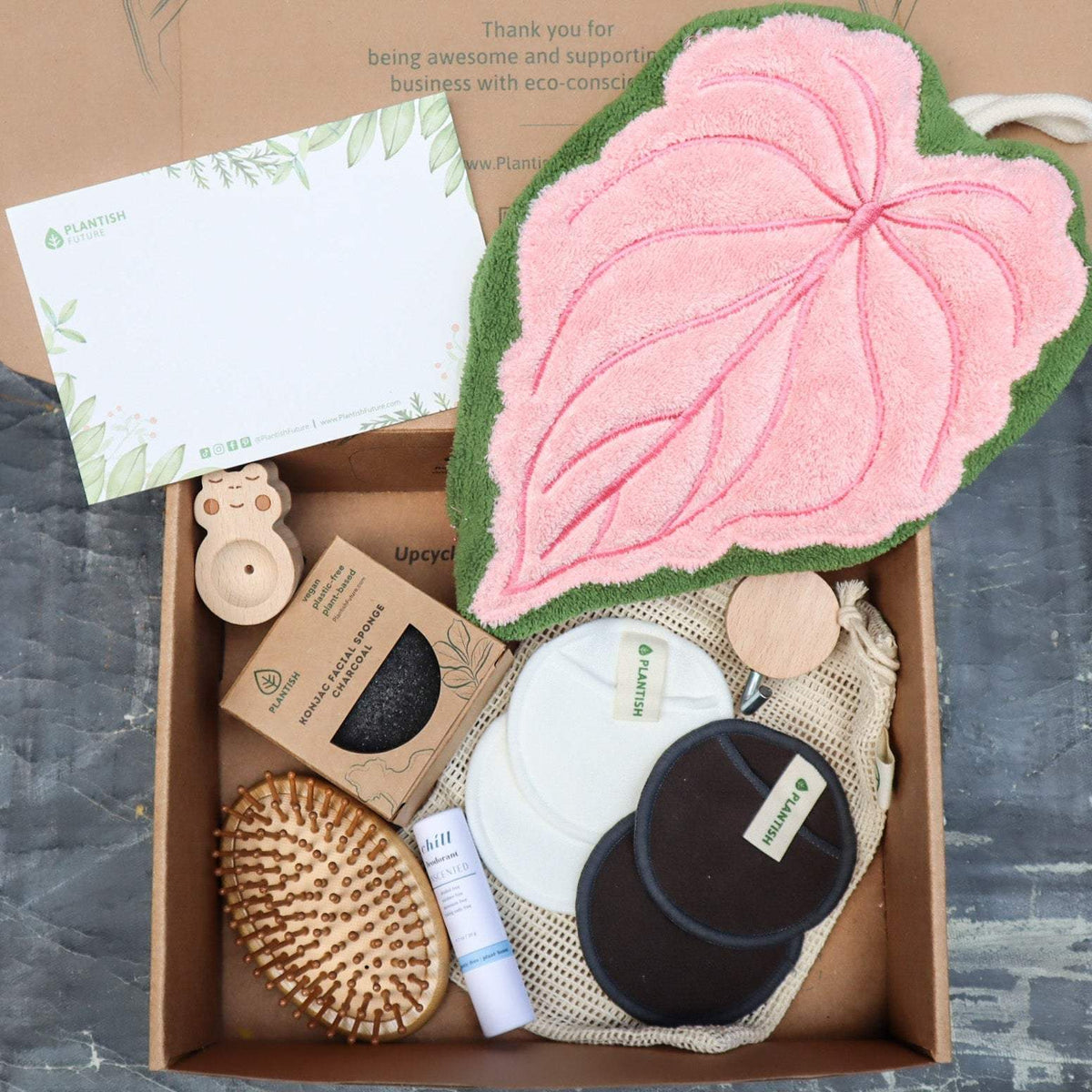 Zero Waste Cleaning Set with pink and green leaf-shaped cleaning cloth, wooden brush, reusable cotton rounds, natural soap, and wooden diffuser