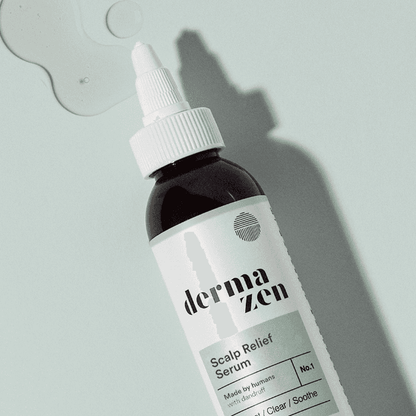 Topical Dermazen Calming Seborrheic Serum bottle with applicator for soothing skin care treatment.