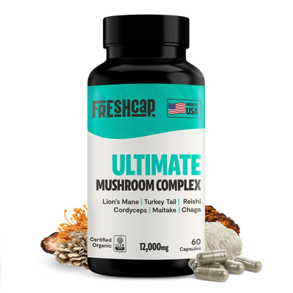 FreshCap Mushrooms Organic Mushroom Complex capsules in a bottle, showcasing the supplement capsules with label details.