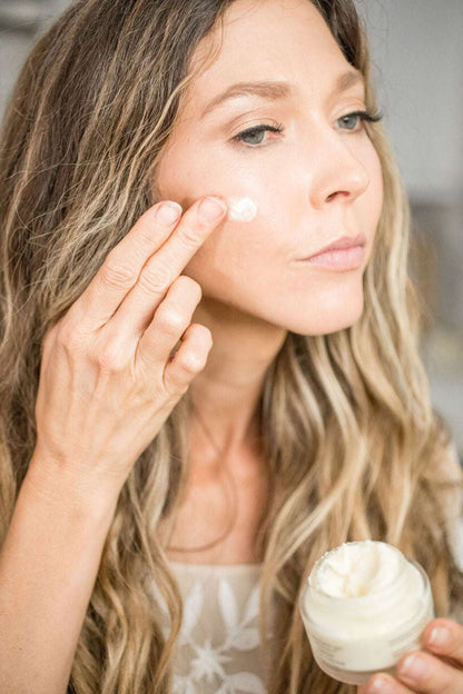 Fresh face cream by Pretty Farm Girl, anti-aging tallow moisturizer in a jar, shown with natural ingredients and skincare application.