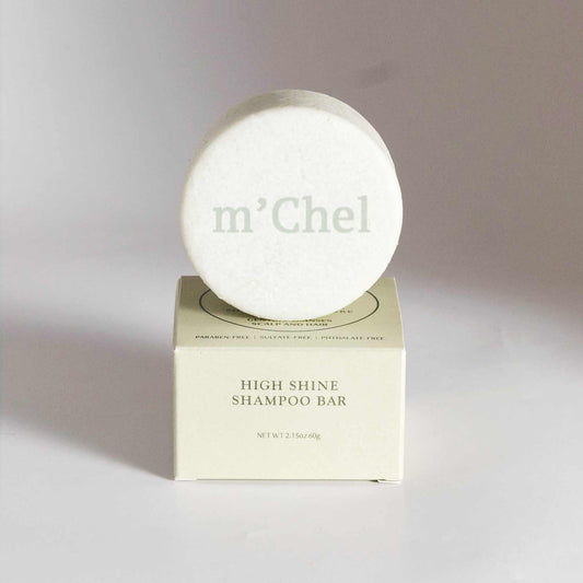 M'Chel Haircare high shine shampoo bar with smooth, rounded shape and glossy finish, ideal for hair cleansing and shine.