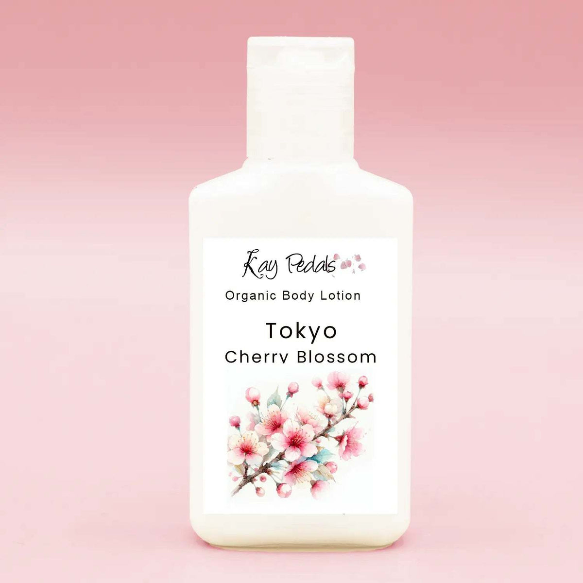 12 oz white plastic bottle of Tokyo Cherry Blossom organic body lotion with floral label and pink cherry blossom illustration