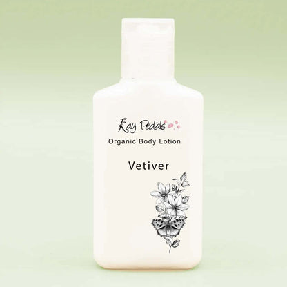 Small white plastic bottle of Kay Pedals Organic Body Lotion vetiver scent with floral and butterfly design, part of Kay Pedals Scent Discovery Trio.