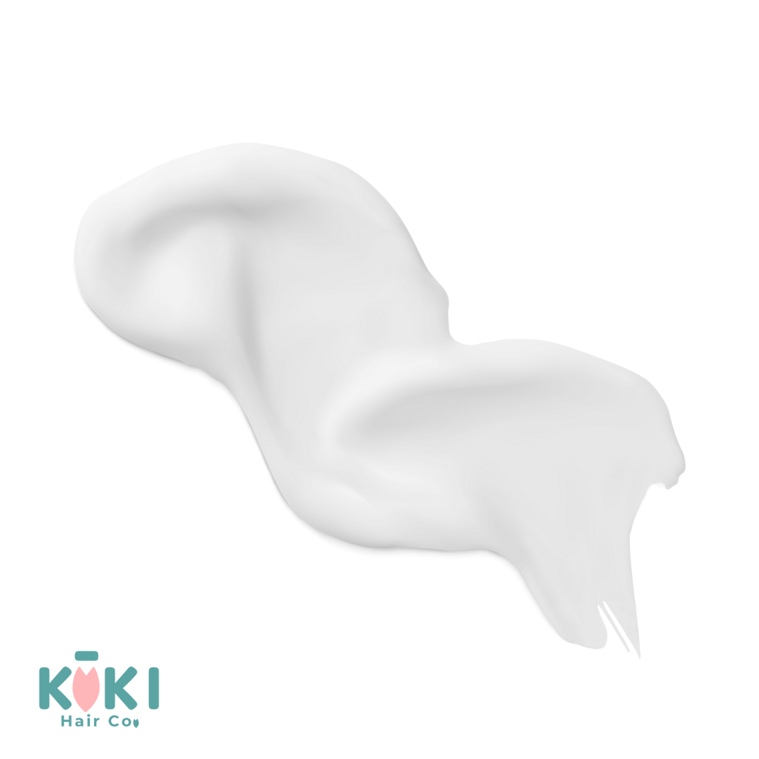 Creamy white shampoo lather with smooth texture, highlighting the gentle, sulfate-free formula of Everyday Lightweight Shampoo.