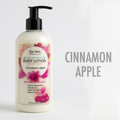 Body lotion in a clear bottle with black pump, creamy white, labeled Cinnamon Apple with floral and berry design, moisturizing formula