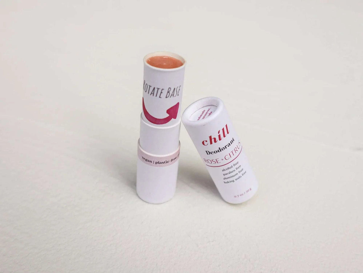 Natural Deodorant Stick in white tube with rose and citrus scent, featuring recyclable packaging and smooth beige product inside.