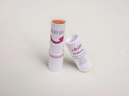 Natural Deodorant Stick in white tube with rose and citrus scent, featuring recyclable packaging and smooth beige product inside.