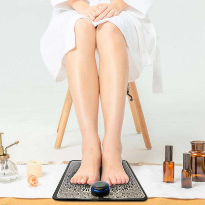 Doba EMS foot massage pad with electric stimulator, showing the rechargeable massager unit for leg and muscle pain relief.