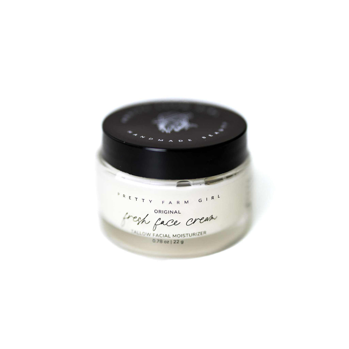 Pretty Farm Girl Fresh Face Cream Anti-Aging Tallow moisturizer in a white jar, showcasing smooth, natural skincare for youthful skin.