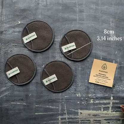 Reusable Cotton Rounds in dark grey bamboo charcoal fabric with circular shape and Plantish label, 8cm diameter.