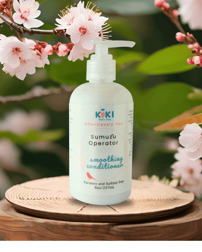 Smoothing conditioner for frizz-free hair in white plastic pump bottle with blue and pink lettering and floral design on label