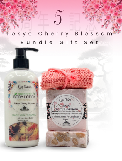 Tokyo Cherry Blossom body lotion in white pump bottle with floral label, paired with two pink cherry blossom soap bars and a coral exfoliating soap pouch.
